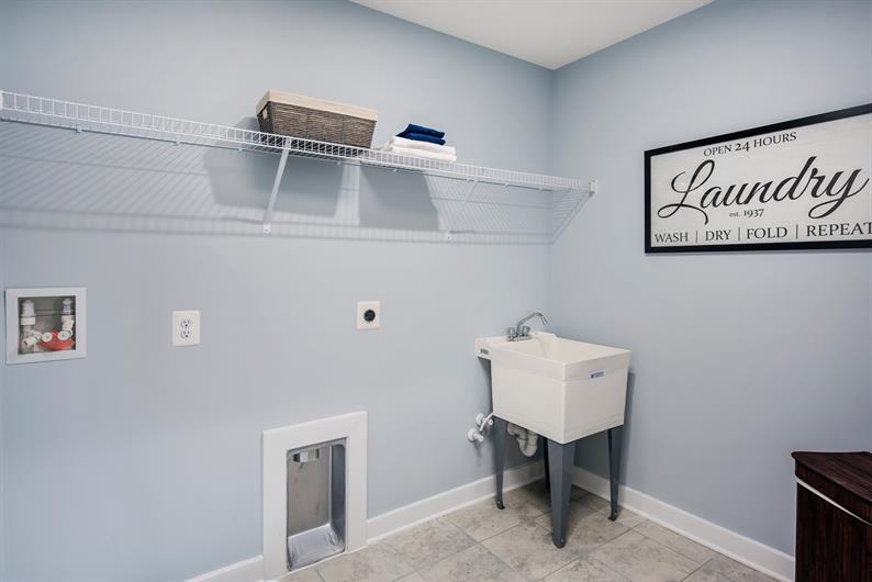 Enjoy the luxuries of a laundry room steps from your owner's suite 