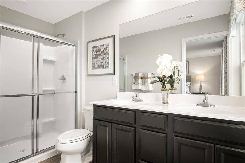 FINALLY ENJOY A BATHROOM WITH DUAL VANITIES AND AMPLE CABINET SPACE 