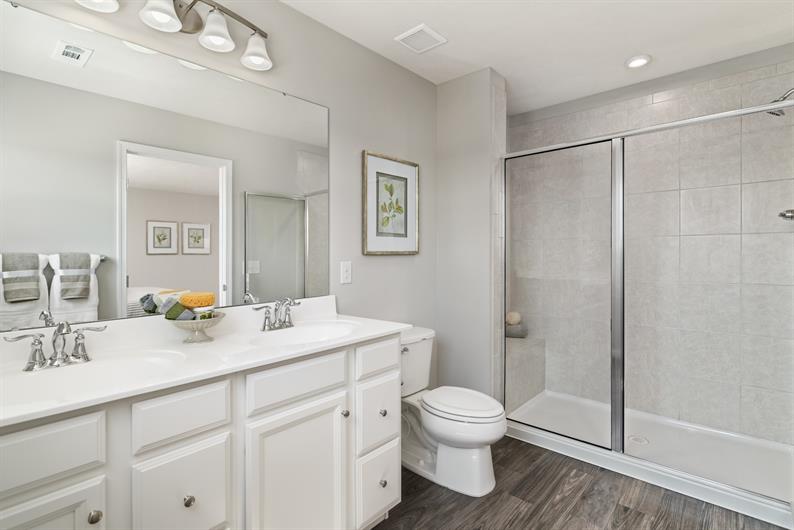 PRIVATE EN SUITE WITH DUAL VANITIES FOR EASY MORNING ROUTINES 