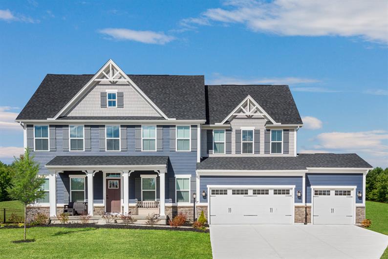 CURBSIDE APPEAL WITH INCLUDED 3-CAR GARAGES PER FLOORPLAN AND STONE AND BRICK DETAILED EXTERIORS 